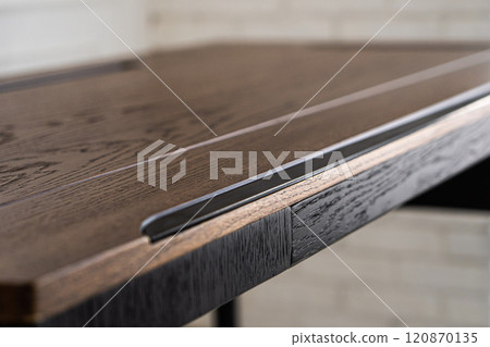 Mobile phone with wireless charger on table. Modern workplace accessory Mobile phone with wireless charger on table. Modern workplace accessory 120870135