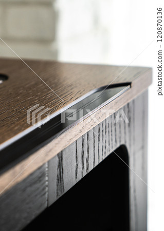 Mobile phone with wireless charger on table. Modern workplace accessory Mobile phone with wireless charger on table. Modern workplace accessory 120870136