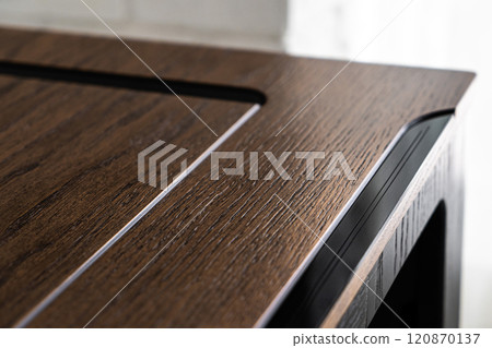 Mobile phone with wireless charger on table. Modern workplace accessory Mobile phone with wireless charger on table. Modern workplace accessory 120870137