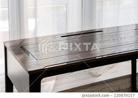 Empty rough wooden table top in the dark room Empty rough wooden table top in the dark room 120870157