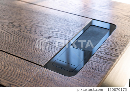 Mobile phone with wireless charger on table. Modern workplace accessory Mobile phone with wireless charger on table. Modern workplace accessory 120870173