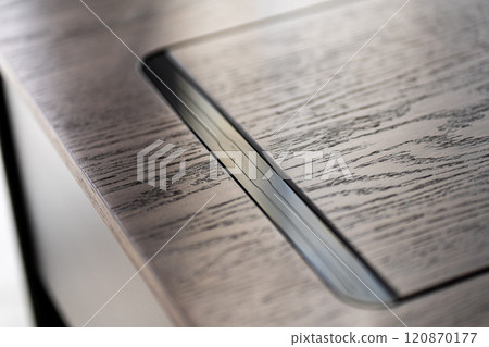 Mobile phone with wireless charger on table. Modern workplace accessory 120870177