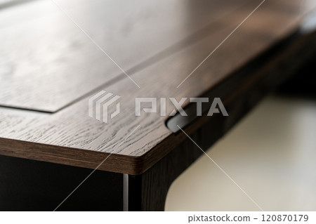 Empty rough wooden table top in the dark room Empty rough wooden table top in the dark room 120870179