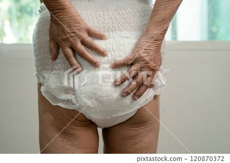 Asian senior woman patient wearing incontinence diaper in hospital, healthy strong medical. 120870372