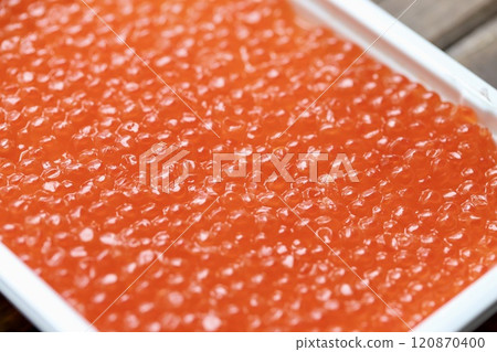 Hokkaido salmon roe marinated in soy sauce in a plastic case Hokkaido salmon roe marinated in soy sauce in a plastic case 120870400
