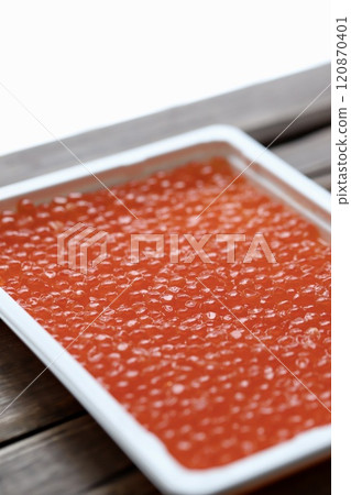 Hokkaido salmon roe marinated in soy sauce in a plastic case Hokkaido salmon roe marinated in soy sauce in a plastic case 120870401