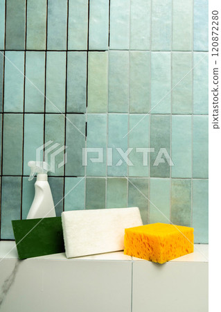 Various cleaning tools arranged for epoxy grout repair in a tiled bathroom. Vertical photo. 120872280
