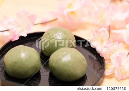 Japanese sweets mugwort mochi with cherry blossoms Japanese sweets mugwort mochi with cherry blossoms 120872338