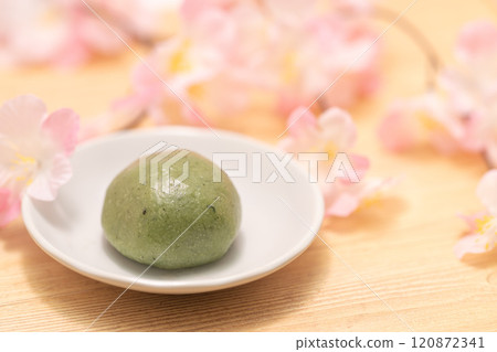 Japanese sweets mugwort mochi with cherry blossoms Japanese sweets mugwort mochi with cherry blossoms 120872341