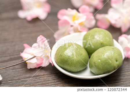 Japanese sweets mugwort mochi with cherry blossoms Japanese sweets mugwort mochi with cherry blossoms 120872344