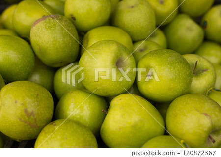 Delicious green apples on a market counter Delicious green apples on a market counter 120872367
