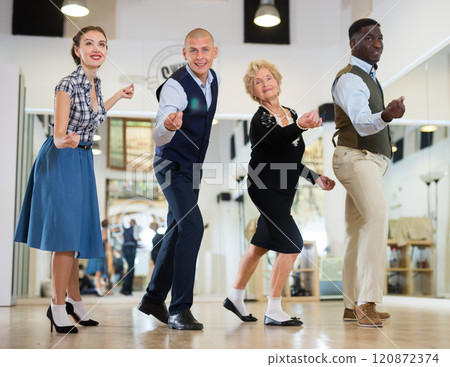 Men and women swing dancers flicking Men and women swing dancers flicking 120872374