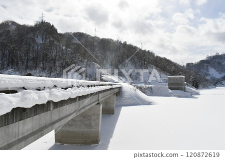 A huge snow-covered bridge leading to Yokokawa Dam A huge snow-covered bridge leading to Yokokawa Dam 120872619