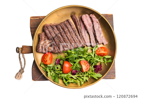 Roast dry aged Top Sirloin beef steak on plate with salad isolated on white background Roast dry aged Top Sirloin beef steak on plate with salad isolated on white background 120872694