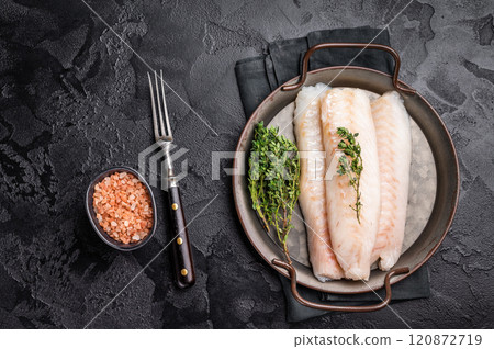 Raw Loin cod fish fillets ready for cooking whitefish in stell tray. black background. top view 120872719