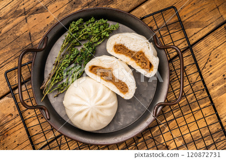 Chinese Bao Baozi steam bun with meat on steel tray. wooden background. top view 120872731