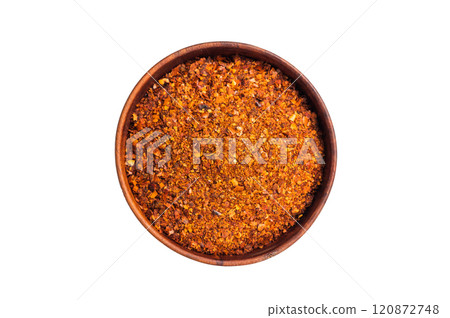 Chili pepper and paprika red flakes in a bowl isolated on white background. top view Chili pepper and paprika red flakes in a bowl isolated on white background. top view 120872748