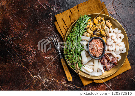Seafood platter, mix of mussels, clams, squid, octopus, shrimps and prawn. Dark background. Top view. Copy space 120872810