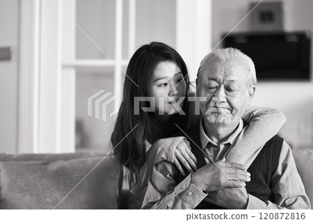 young asian adult daughter conforting senior father at home young asian adult daughter conforting senior father at home 120872816
