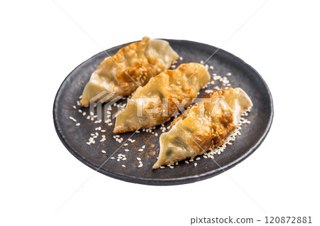 Fried Chinese Dumplings Jiaozi with shrimps and vegetables on plate isolated on white background. top view Fried Chinese Dumplings Jiaozi with shrimps and vegetables on plate isolated on white background. top view 120872881