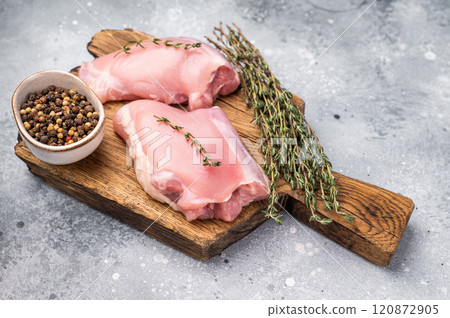 Chicken thigh fillet, raw Skinless boneless poultry meat. grey background. top view Chicken thigh fillet, raw Skinless boneless poultry meat. grey background. top view 120872905