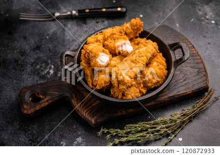 Fried chicken fillet tender strips. wooden background. top view Fried chicken fillet tender strips. wooden background. top view 120872933