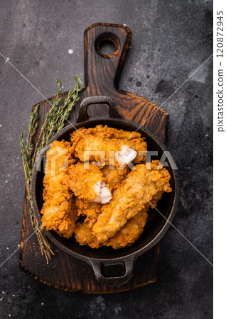 Fried chicken fillet tender strips. wooden background. top view 120872945