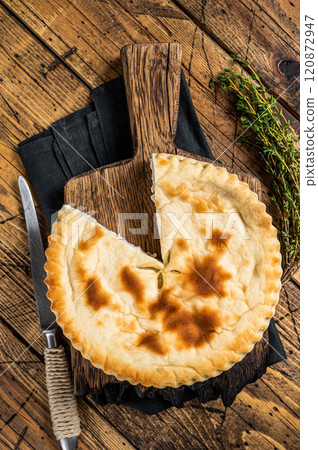 Kubdari Bread, Tasty Flat Bread Stuffed with Spiced meat. Wooden background. Top view 120872947