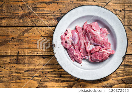Pieces of raw turkey thigh, Poultry fresh meat. Wooden background. Top view. Space for text Pieces of raw turkey thigh, Poultry fresh meat. Wooden background. Top view. Space for text 120872953