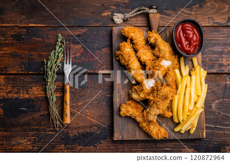 Homemade Deep Fried chicken strips, breast fillet on wooden board. wooden background. top view 120872964
