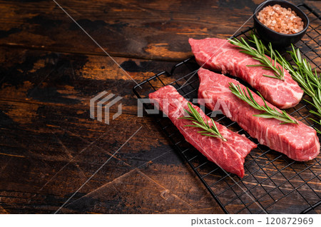 Raw Tri Tip Steak from Black Angus beef meat with rosemary. wooden background. top view 120872969