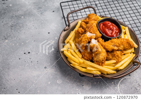Deep fried chicken strips, stick from breast fillet. grey background. top view Deep fried chicken strips, stick from breast fillet. grey background. top view 120872970