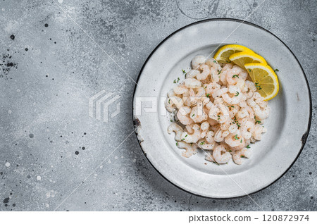 Boiled shrimps seafood with lemon, herbs and spice, prawns peeled. Gray background. top view. copy space 120872974