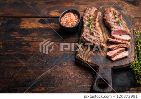 Grilled Tri Tip Steak from Black Angus beef meat. wooden background. top view Grilled Tri Tip Steak from Black Angus beef meat. wooden background. top view 120872981