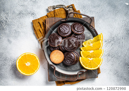 Orange Flavored Round Jaffa Cakes with Chocolate. White background. Top view 120872998