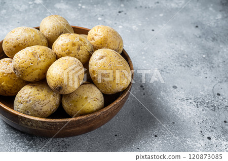 Canarian boiled potatoes papas arrugadas. Gray background. Top view. Copy space Canarian boiled potatoes papas arrugadas. Gray background. Top view. Copy space 120873085