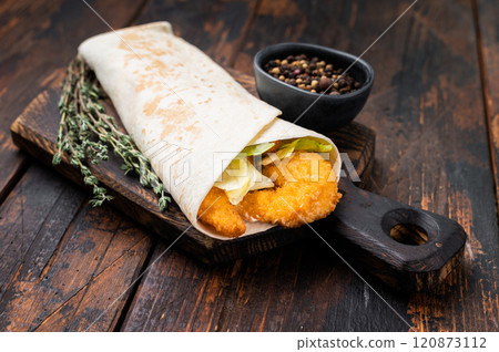 Seafood Shawarma wrap with shrimps, prawns and veggies. wooden background. top view Seafood Shawarma wrap with shrimps, prawns and veggies. wooden background. top view 120873112