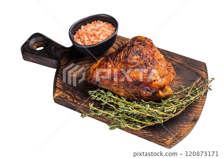 Oven Baked chicken thigh with spices and herb on wooden board isolated on white background. top view Oven Baked chicken thigh with spices and herb on wooden board isolated on white background. top view 120873171