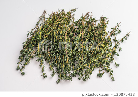 Fresh thyme sprigs bunch isolated on white background. top view Fresh thyme sprigs bunch isolated on white background. top view 120873438