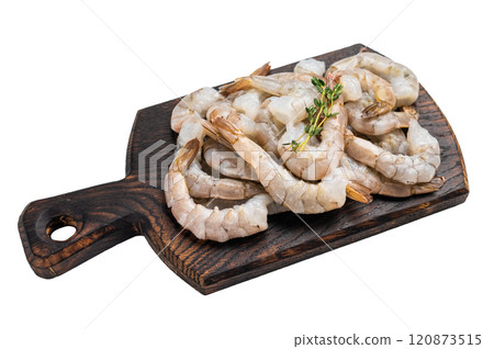 Raw shrimps, headless fresh prawns on a wooden board isolated on white background. 120873515