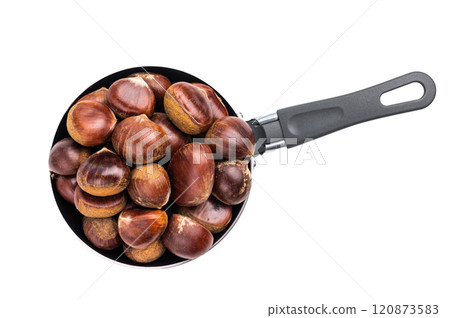 Raw chestnuts in rustic skillet ready for cooking isolated on white background Raw chestnuts in rustic skillet ready for cooking isolated on white background 120873583