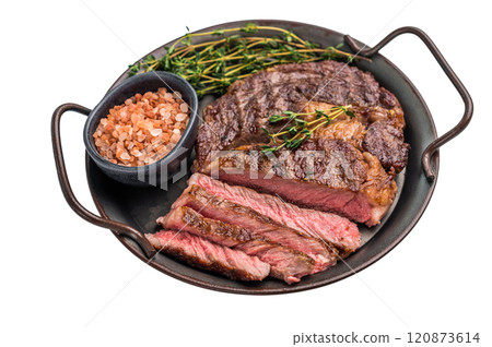 Grilled Rib eye steak with herbs in a tray, roast prime beef meat isolated on white background 120873614