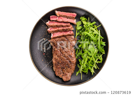 BBQ Grilled Striploin steak on a plate with salad, strip steak, prime roast beef meat isolated on white background 120873619