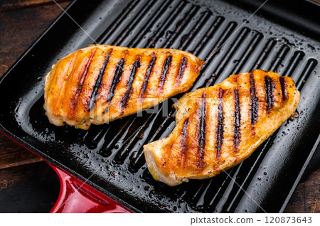 Roasted on grill pan Chicken breasts, fried poultry meat steaks, top view, wooden background. 120873643