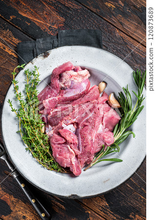 Pieces of raw turkey thigh, Poultry fresh meat. Wooden background. Top view Pieces of raw turkey thigh, Poultry fresh meat. Wooden background. Top view 120873689