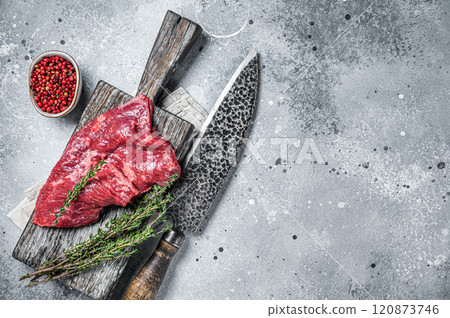 Skirt or Machete beef steak, raw meat with herbs and spices. Gray background. Top view. Copy space Skirt or Machete beef steak, raw meat with herbs and spices. Gray background. Top view. Copy space 120873746