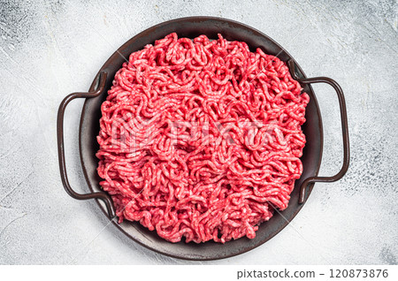 Raw Mince Ground meat in a kitchen tray. White background. Top view 120873876