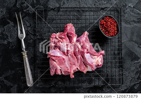 Raw Turkey sliced fillet meat ready for cooking. Black background. Top view Raw Turkey sliced fillet meat ready for cooking. Black background. Top view 120873879
