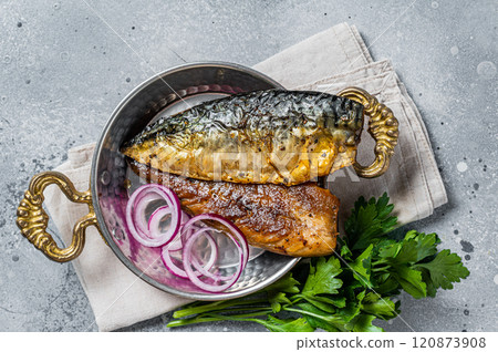 Roasted mackerel soba fish fillet with herbs in a skillet. Gray background. Top view 120873908