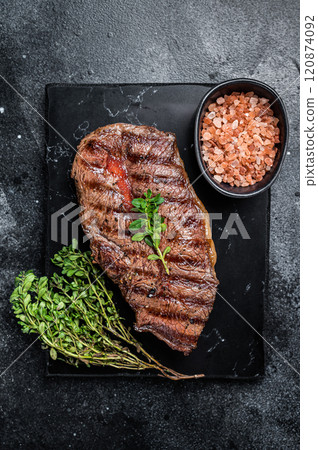 BBQ roasted Shoulder Top Blade or Australia wagyu oyster blade beef steak. Black background. Top View 120874092